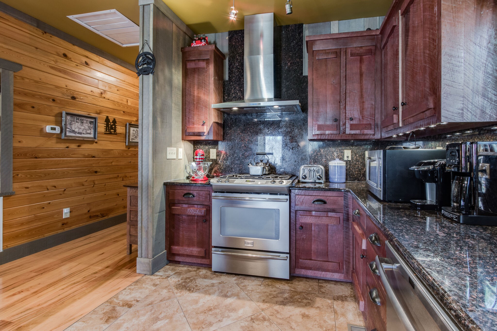210 Double Check Lane Belvidere, TN 37306 - Photo 14 of 48 a kitchen with stainless steel appliances granite countertop a stove and a refrigerator
