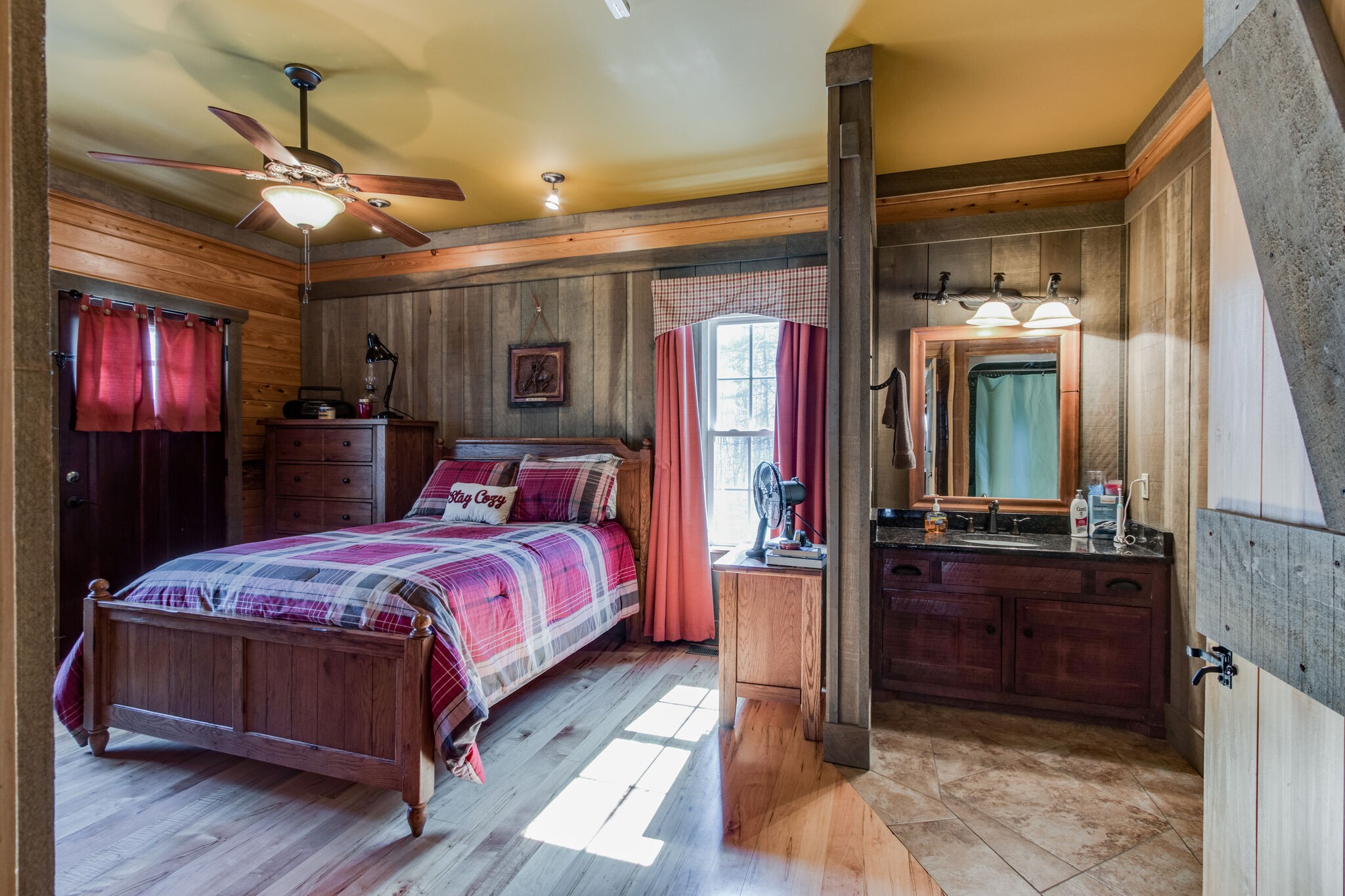 210 Double Check Lane Belvidere, TN 37306 - Photo 21 of 48 a bedroom with a large bed and a chandelier