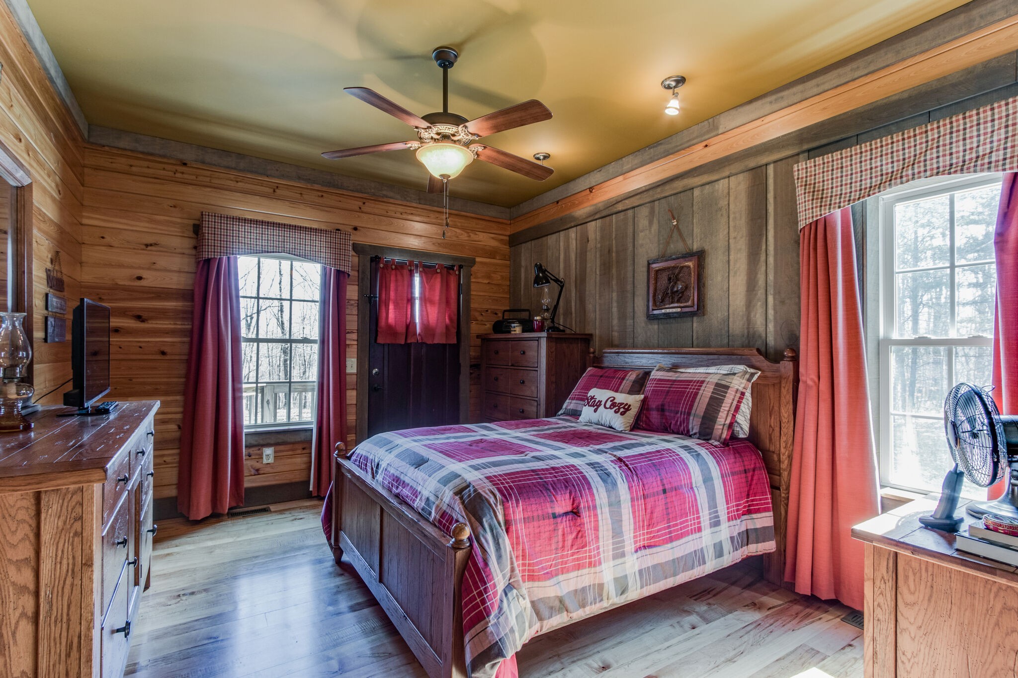210 Double Check Lane Belvidere, TN 37306 - Photo 22 of 48 a bedroom with a bed and a chandelier