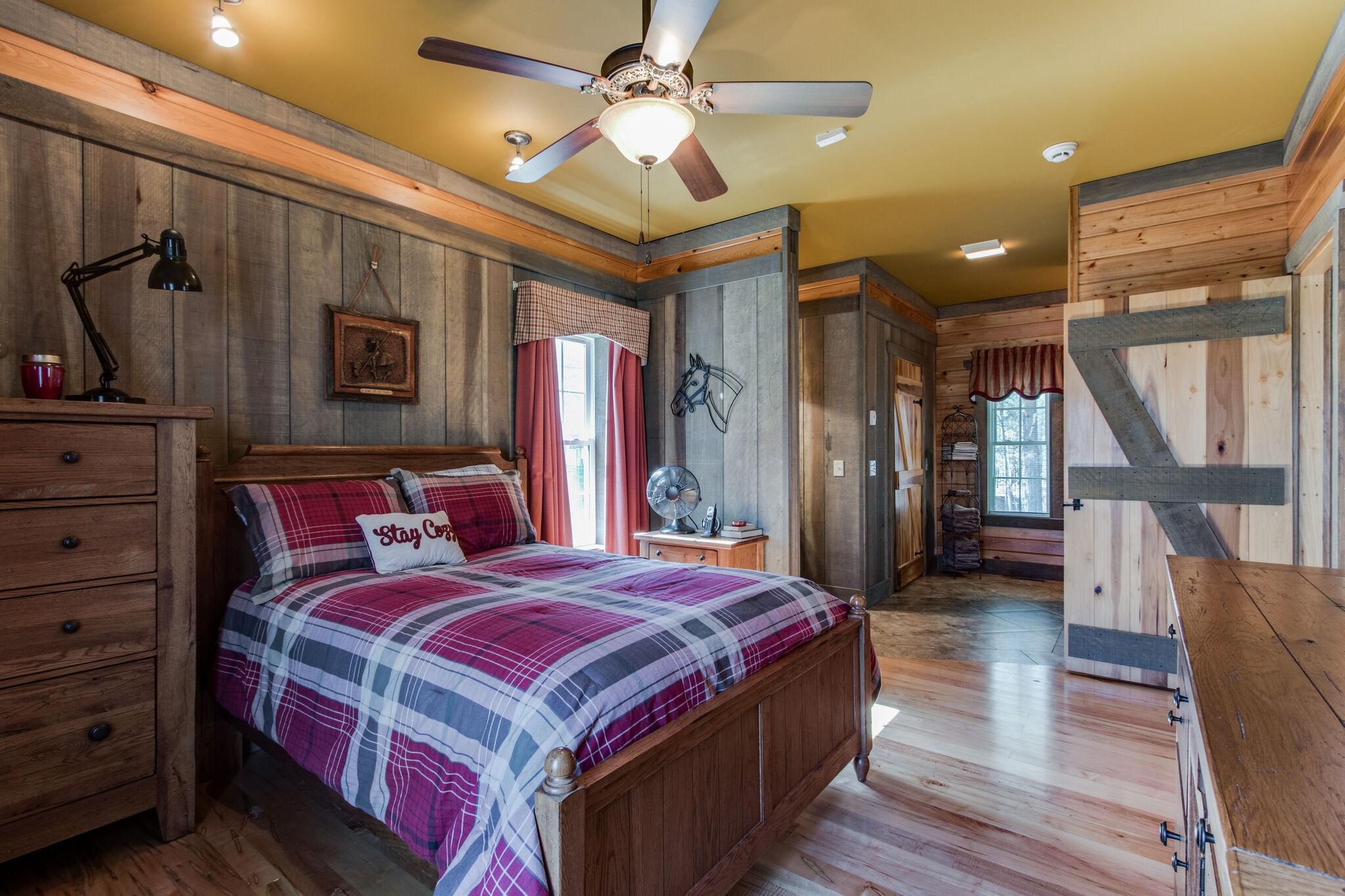 210 Double Check Lane Belvidere, TN 37306 - Photo 23 of 48 a bedroom with a bed a dresser and wooden floor