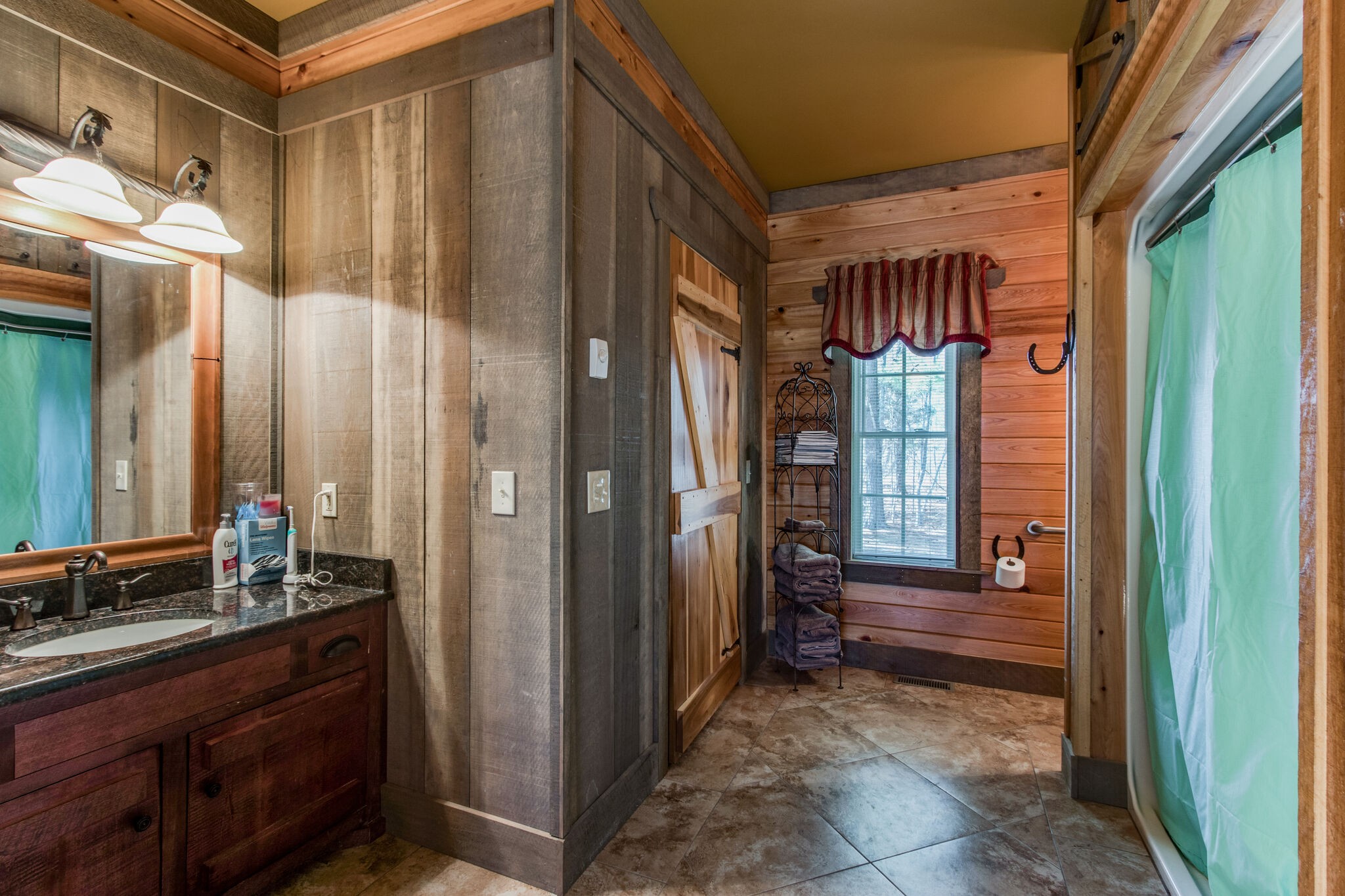 210 Double Check Lane Belvidere, TN 37306 - Photo 24 of 48 a view of a bathroom with a shower and a sink