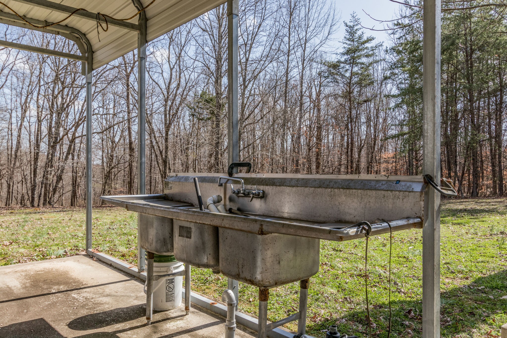 210 Double Check Lane Belvidere, TN 37306 - Photo 29 of 48 a backyard of a house with table and chairs