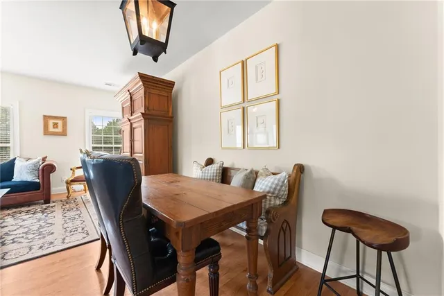 a view of a dining room with furniture and window