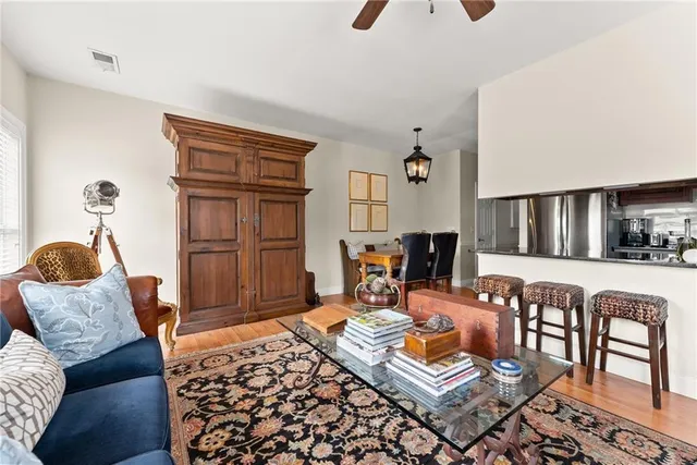a living room with furniture and a rug