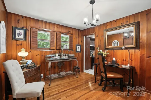 a view of a livingroom with furniture window and wooden floor