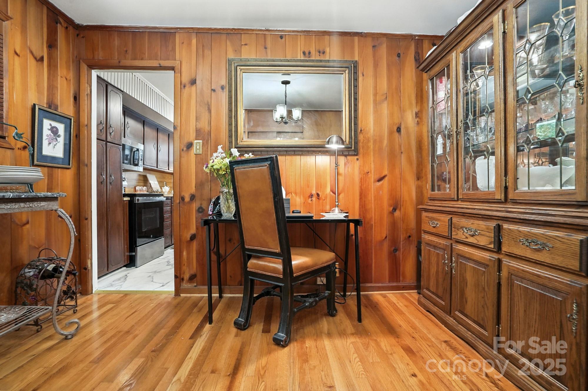 4825 Edgeland Road Edgemoor, SC 29712 - Photo 17 of 34 a view of a workspace with furniture and wooden floor