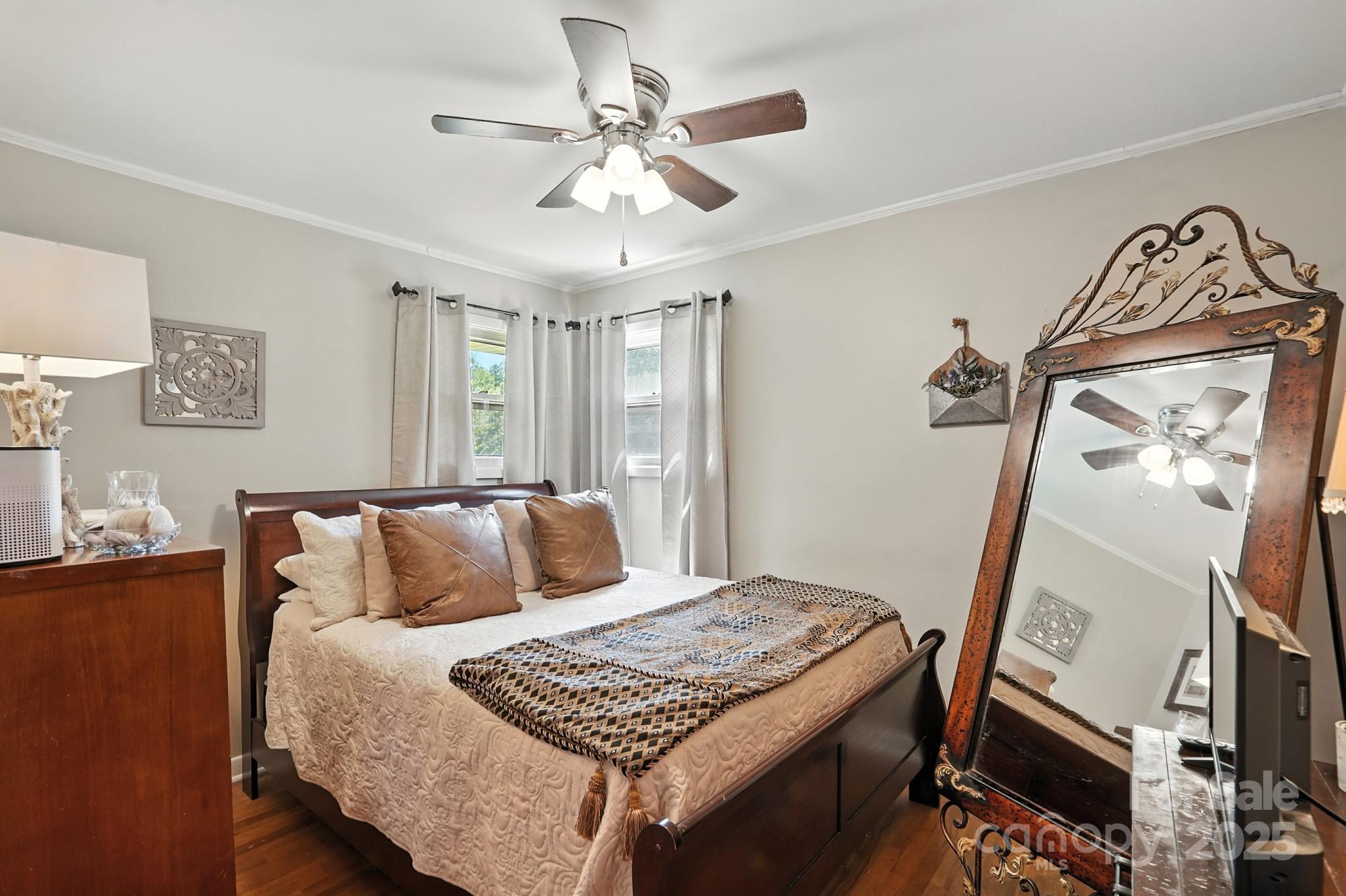 4825 Edgeland Road Edgemoor, SC 29712 - Photo 20 of 34 a bedroom with a bed and a flat tv screen on the dresser