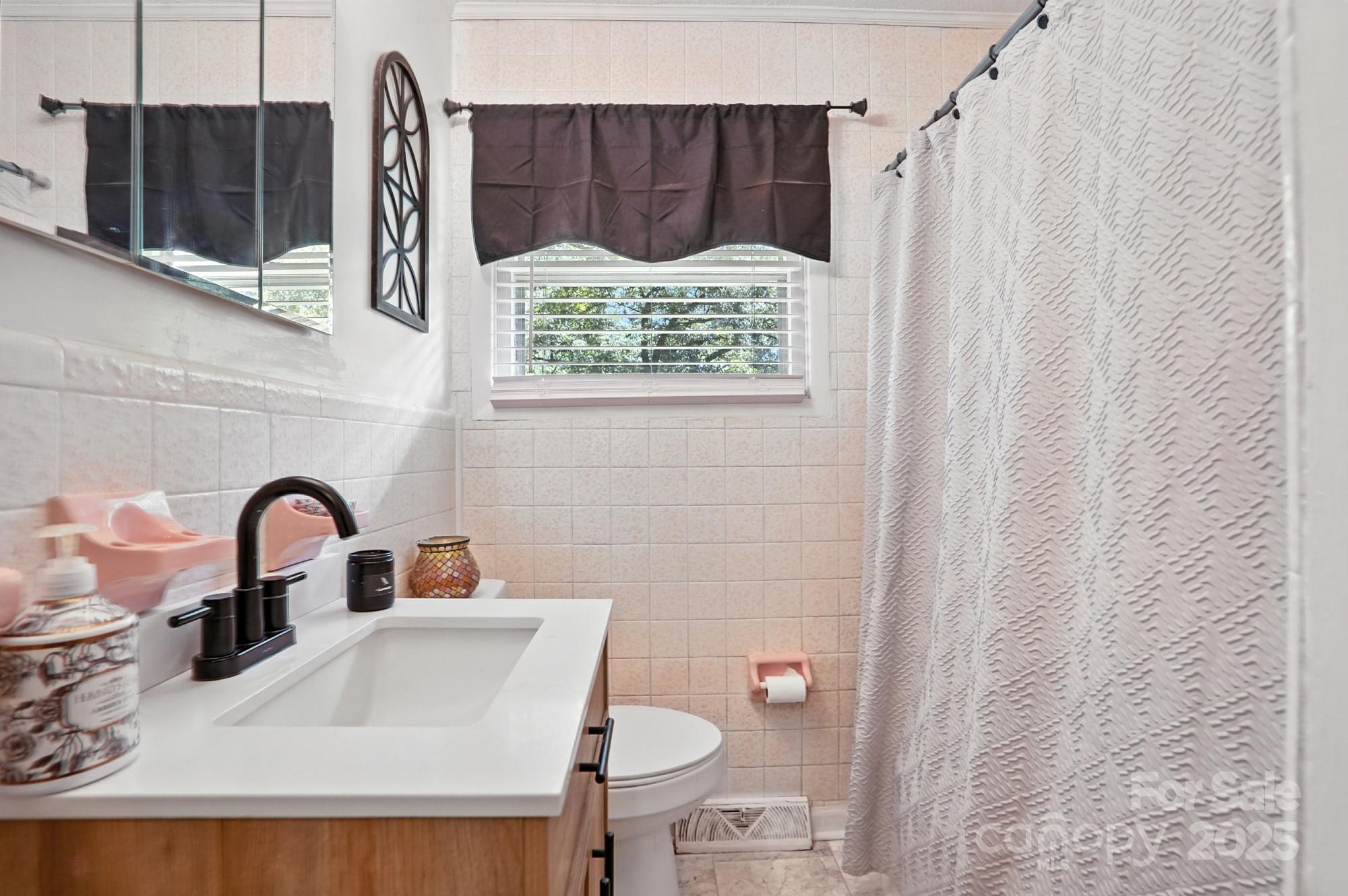 4825 Edgeland Road Edgemoor, SC 29712 - Photo 22 of 34 a bathroom with a sink and a mirror
