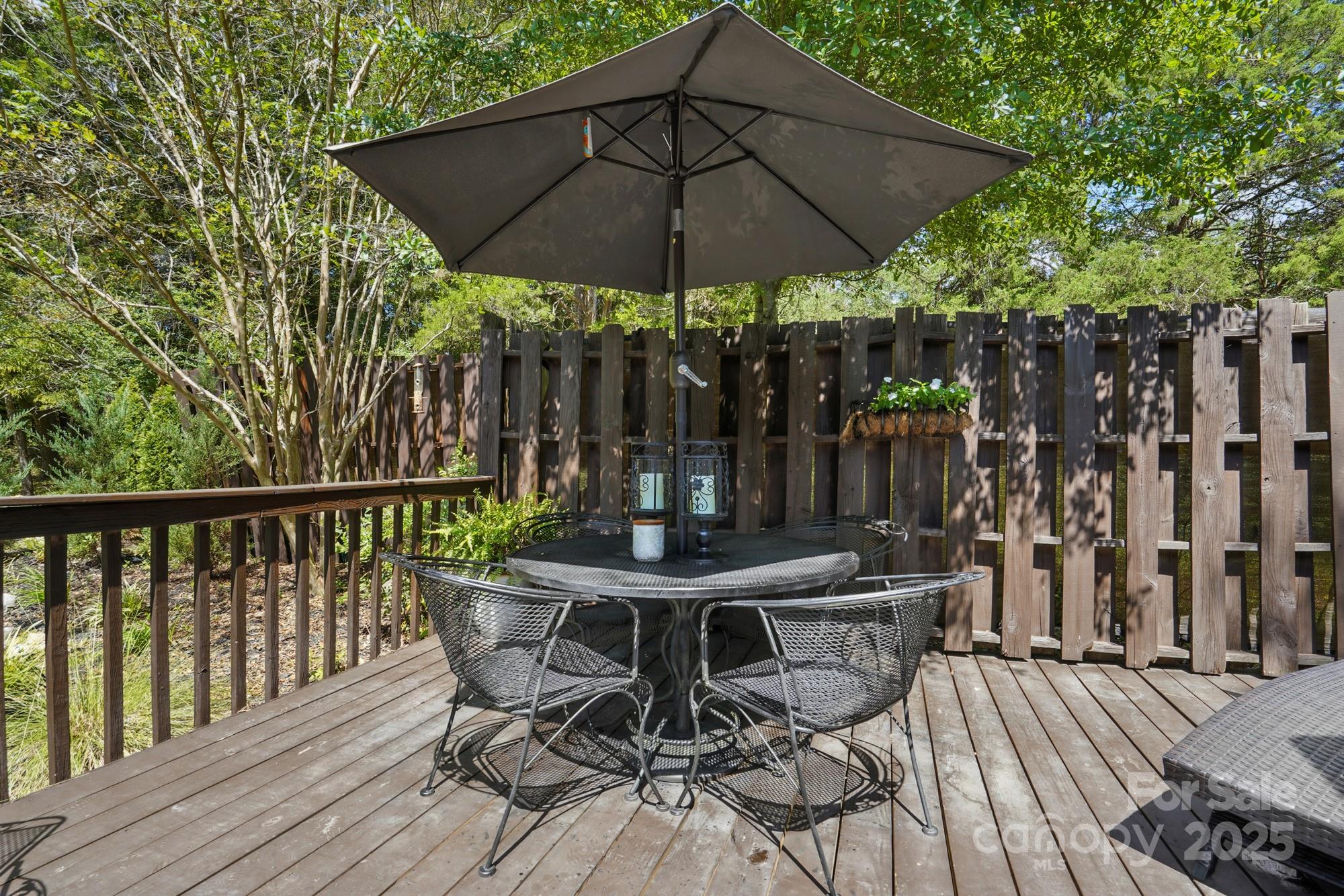 4825 Edgeland Road Edgemoor, SC 29712 - Photo 31 of 34 a view of a table and chairs under an umbrella