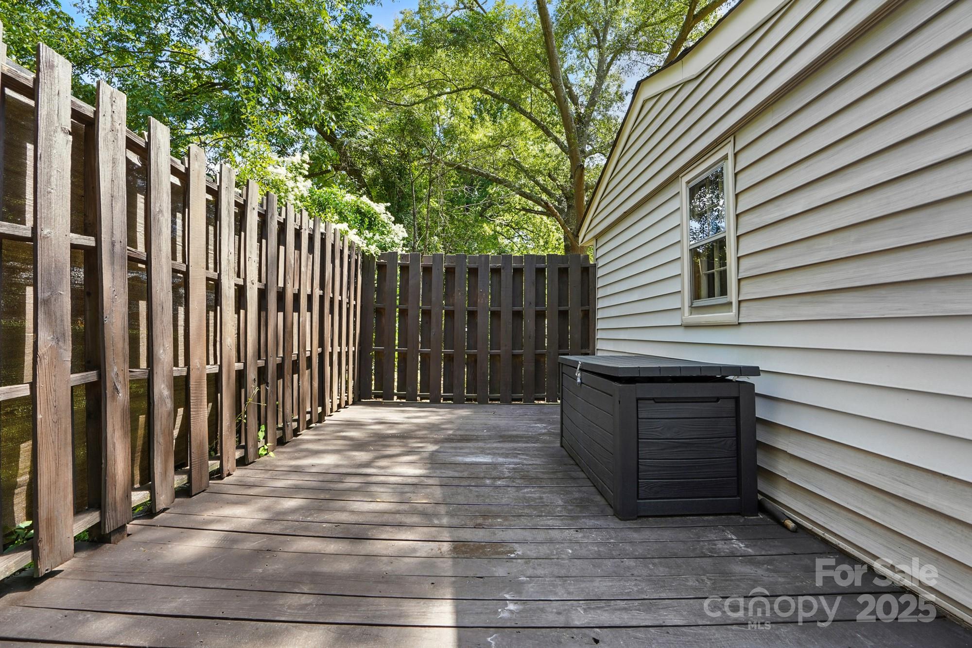 4825 Edgeland Road Edgemoor, SC 29712 - Photo 32 of 34 a view of backyard with wooden fence and large trees