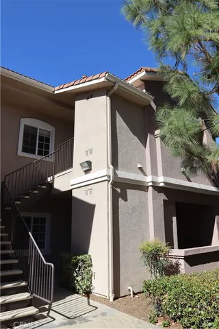 a front view of house with parking space