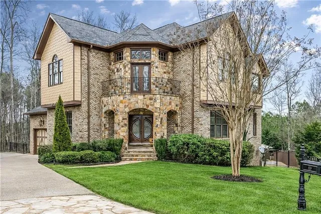 a front view of a house with garden
