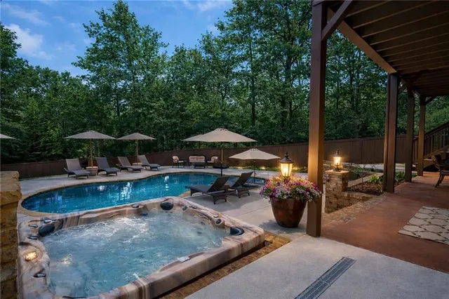 an outdoor space with furniture and umbrella