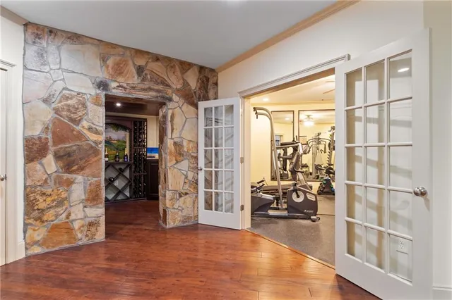 a view of a livingroom with furniture and a large window