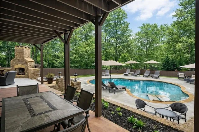 an outdoor view of the patio and swimming pool