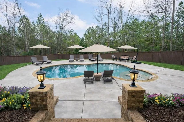 a view of a backyard with sitting area and furniture