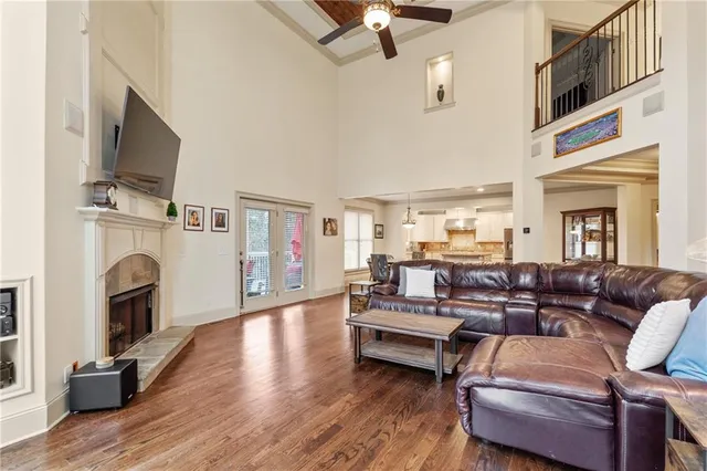 a living room with furniture fireplace and flat screen tv