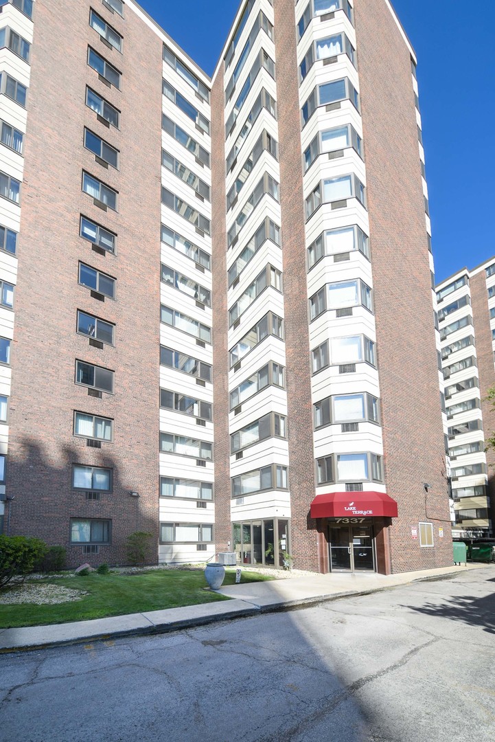 7337 South South Shore Drive, Unit 708 Chicago, IL 60649 - Photo 1 of 14 a front view of a multi story building