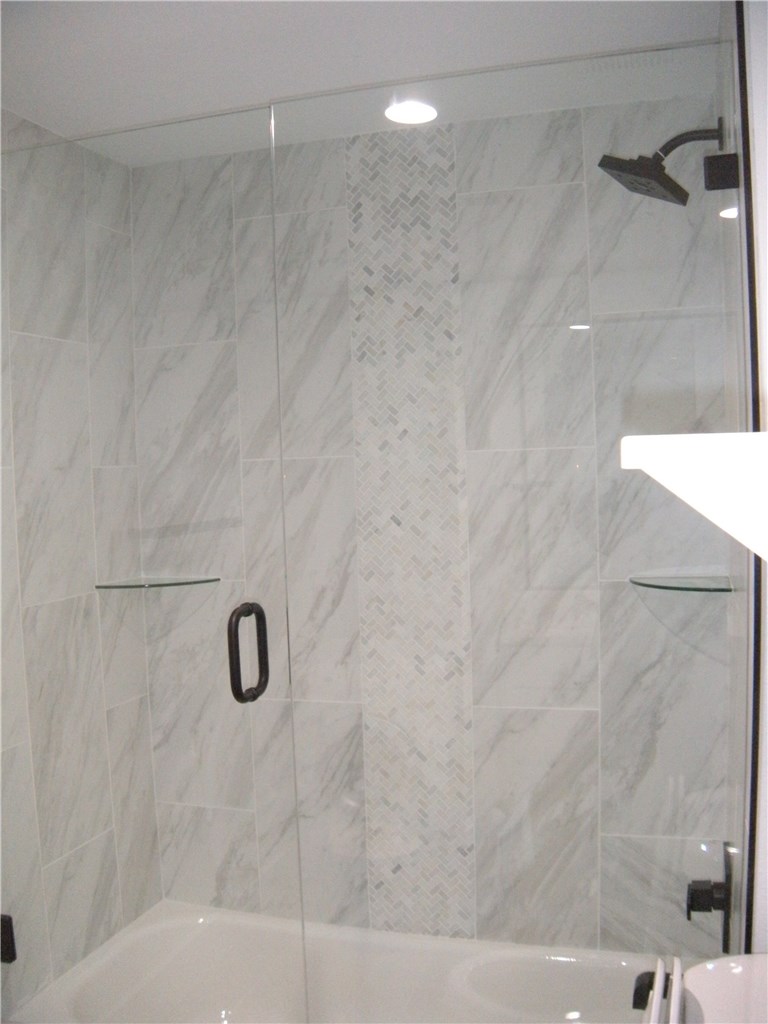 2529 Rio Grande Street, Unit 79 Austin, TX 78705 - Photo 11 of 13 a bathroom with a shower