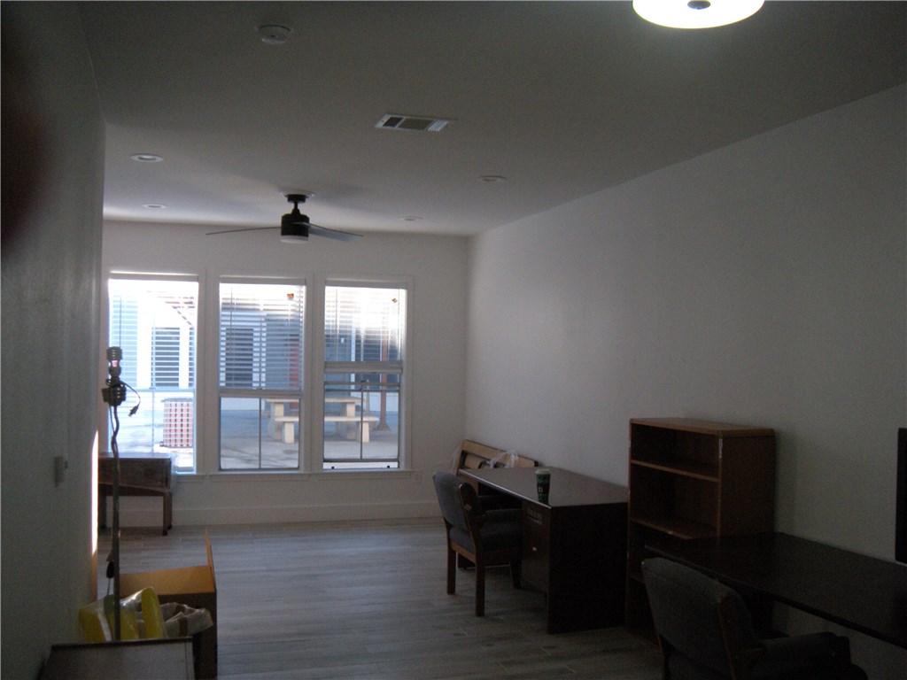 2529 Rio Grande Street, Unit 79 Austin, TX 78705 - Photo 2 of 13 a view of a livingroom with furniture and a window