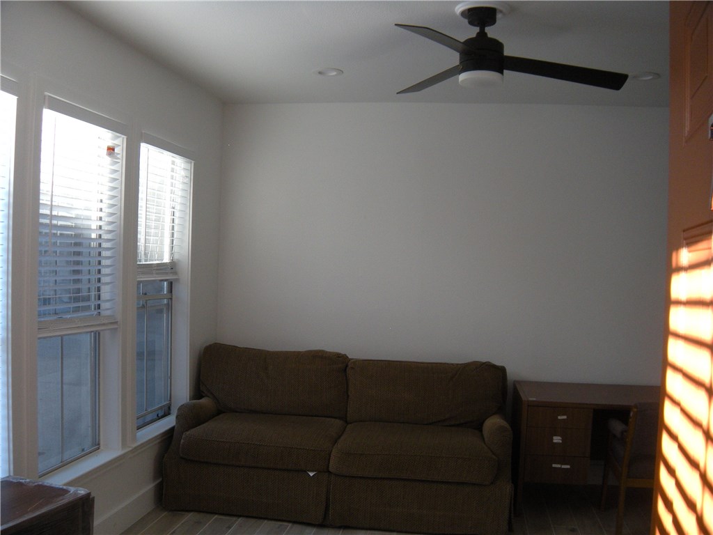 2529 Rio Grande Street, Unit 79 Austin, TX 78705 - Photo 3 of 13 a living room with furniture and a window