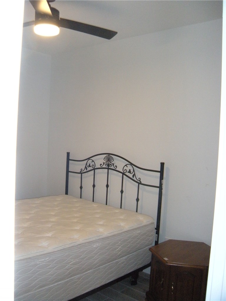2529 Rio Grande Street, Unit 79 Austin, TX 78705 - Photo 9 of 13 a bedroom with a bed and a window