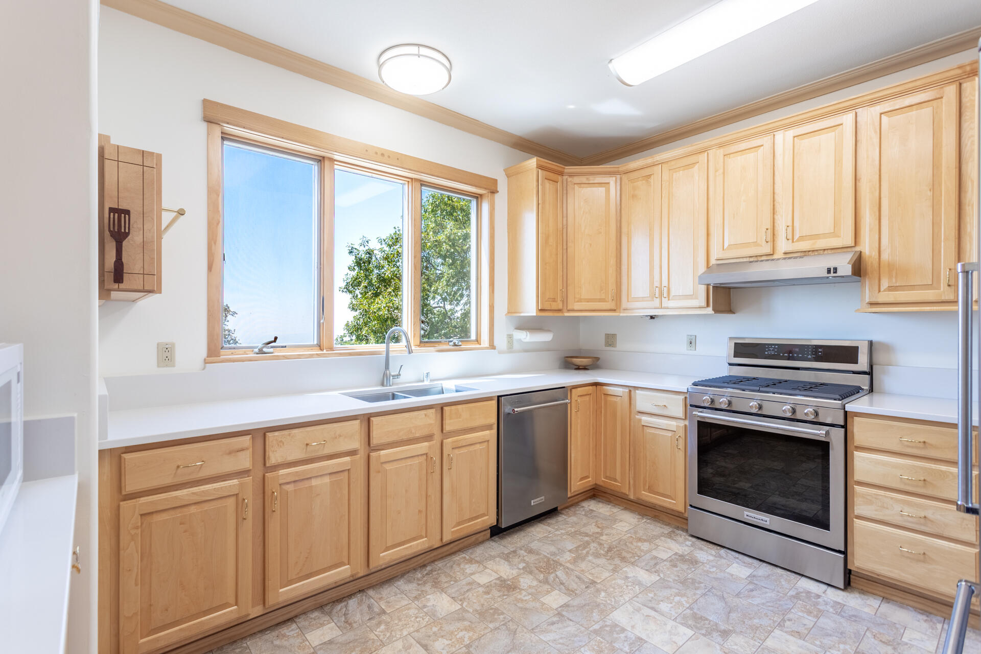 6360 Wilson Hill Road Shingletown, CA 96088 - Photo 11 of 79 a kitchen with white cabinets appliances and a sink