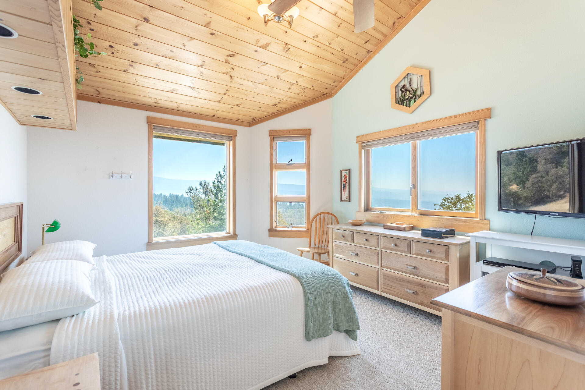 6360 Wilson Hill Road Shingletown, CA 96088 - Photo 16 of 79 a bedroom with a bed and a large window