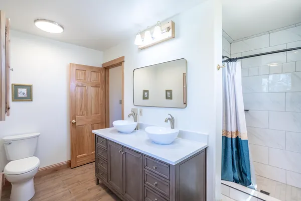 a white toilet sitting next to a bathroom sink