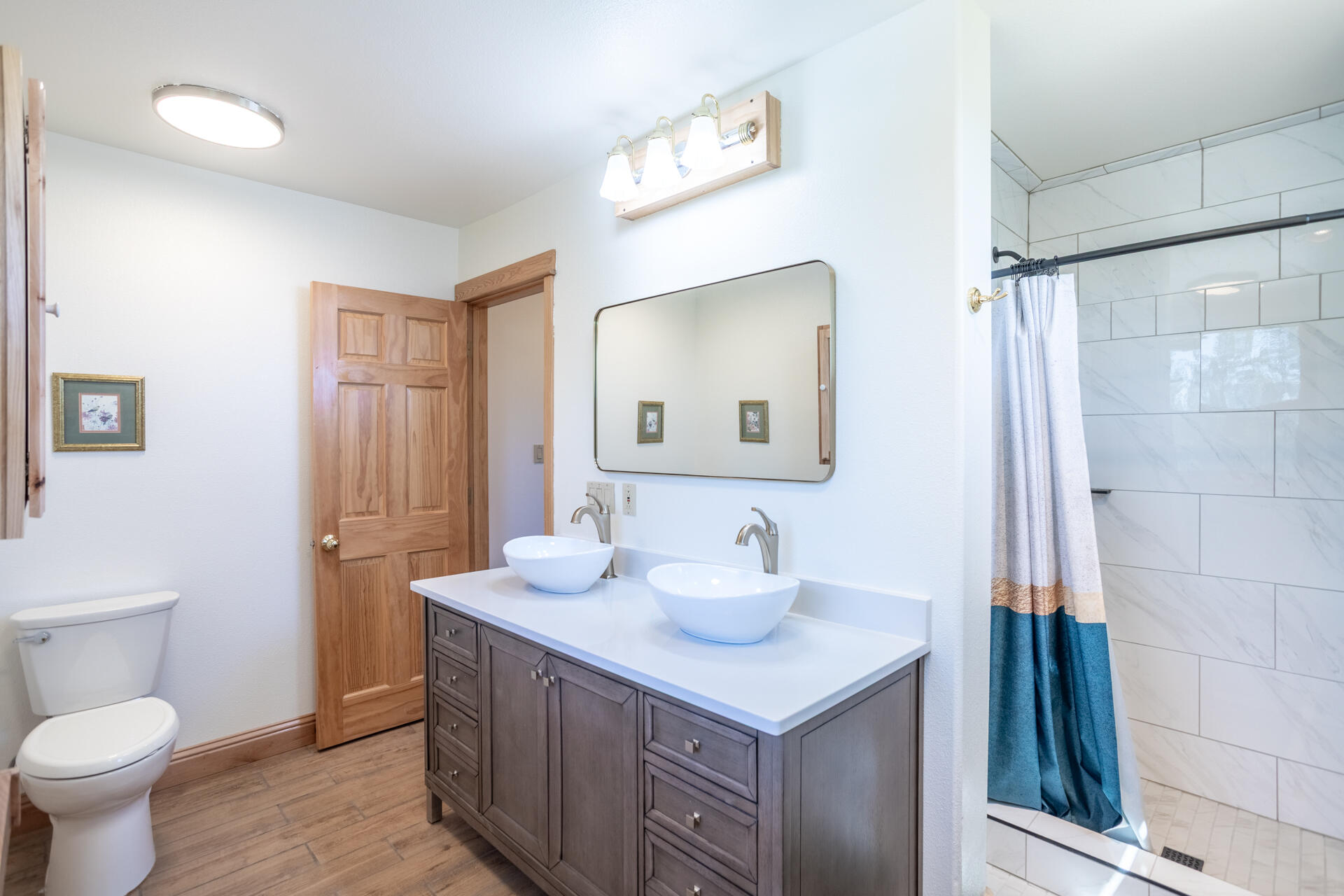 6360 Wilson Hill Road Shingletown, CA 96088 - Photo 17 of 79 a bathroom with a sink a toilet and a mirror
