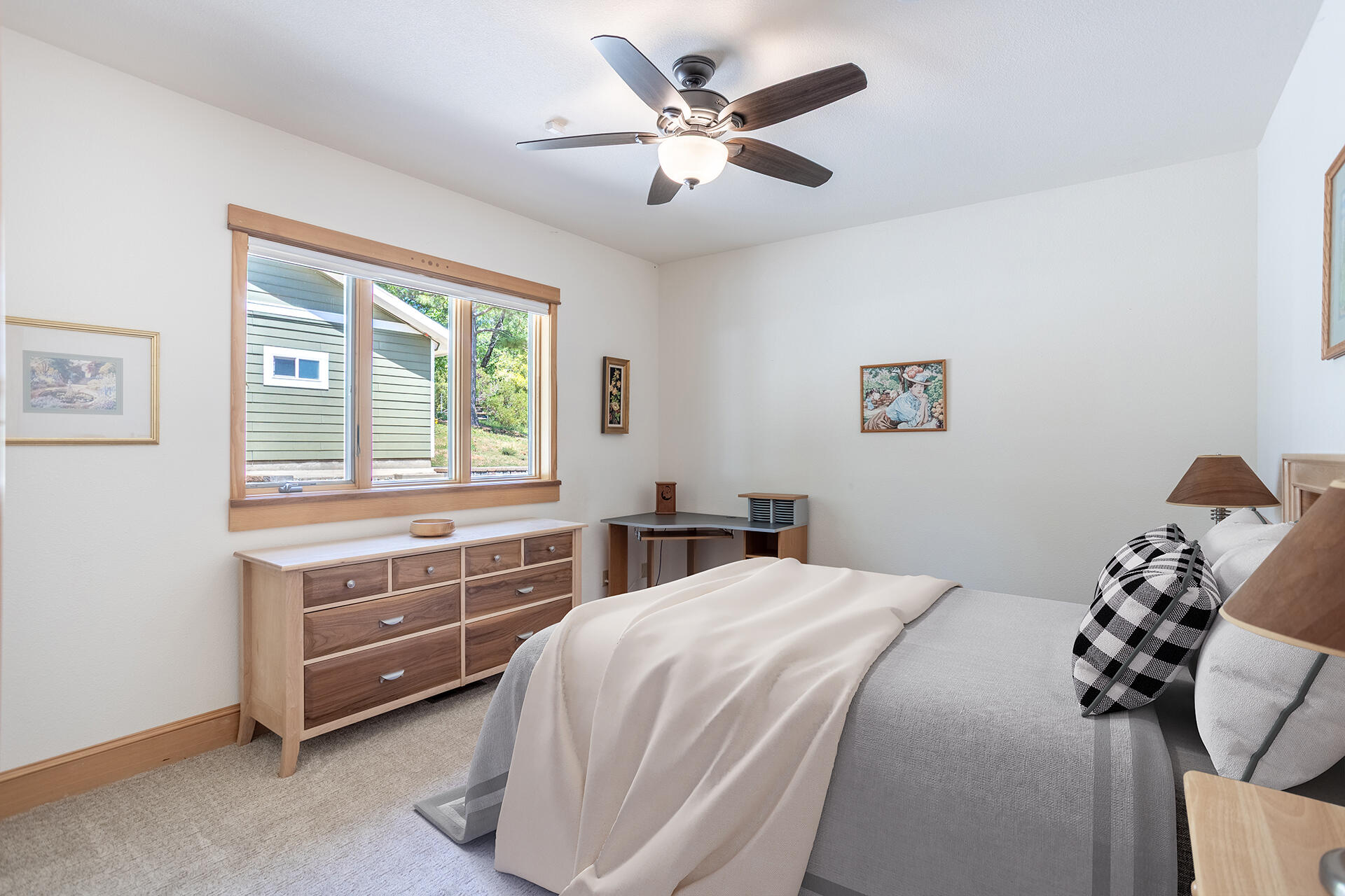 6360 Wilson Hill Road Shingletown, CA 96088 - Photo 21 of 79 a bedroom with a bed and a dresser next to a window
