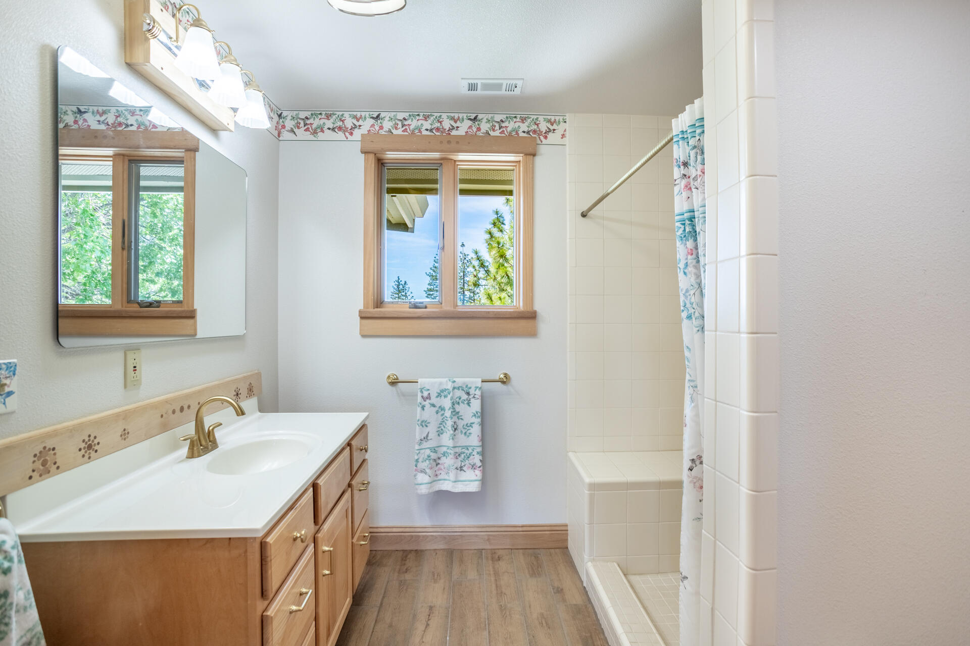 6360 Wilson Hill Road Shingletown, CA 96088 - Photo 23 of 79 a bathroom with a sink a vanity and a mirror