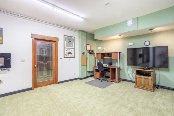 a view of an empty room with wooden walls