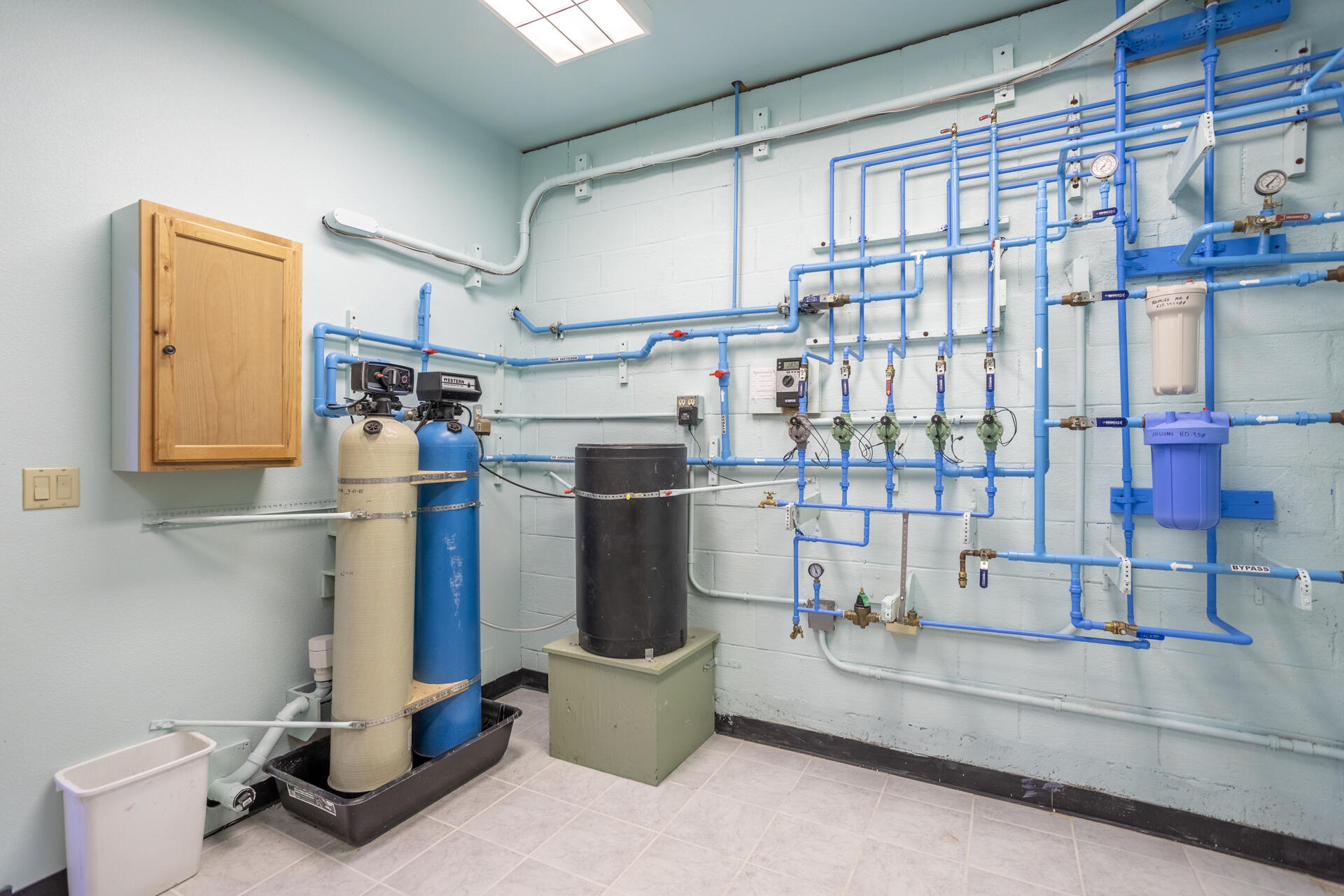 6360 Wilson Hill Road Shingletown, CA 96088 - Photo 33 of 79 a room with water heater and wooden cabinets
