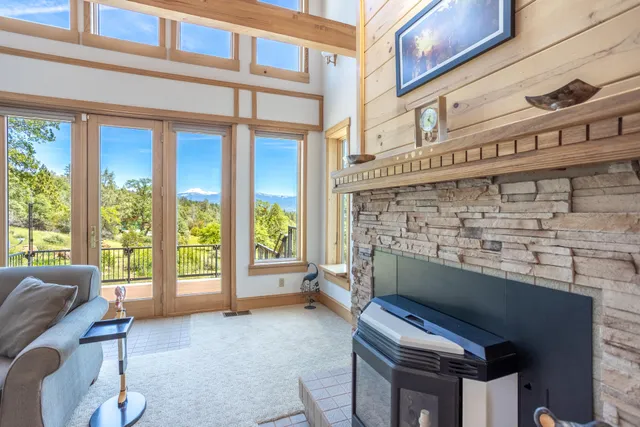 a view of a balcony with wooden floor & fence
