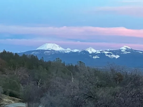 a kitchen with cabinets and stainless steel appliances