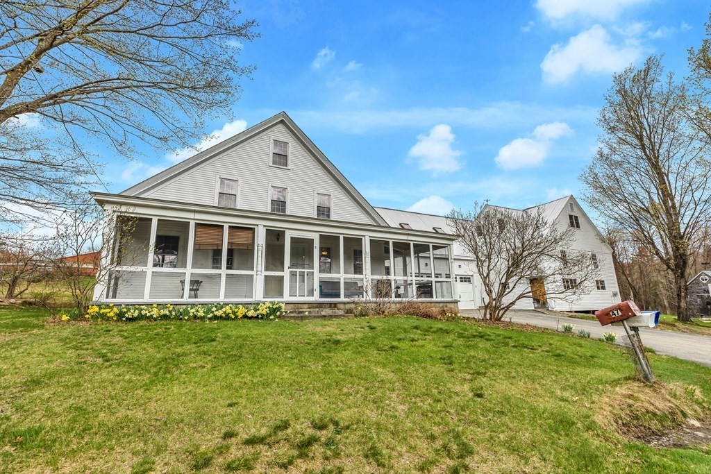 a view of a house with a yard