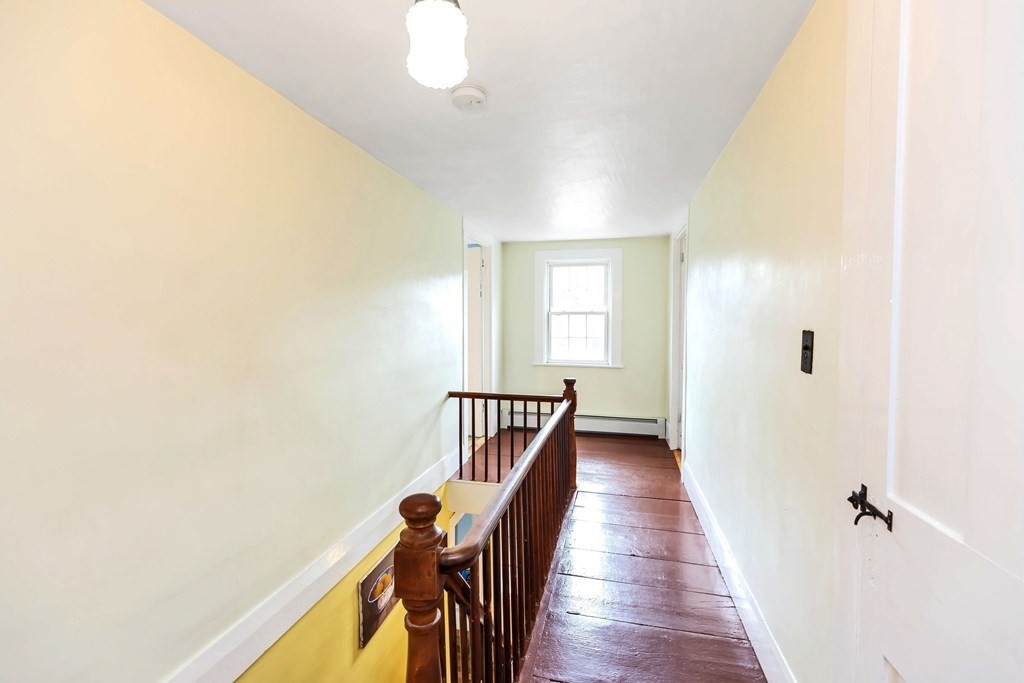 47 Taylor Road New Ipswich, NH 03071 - Photo 19 of 33 a view of a hallway with wooden floor and staircase