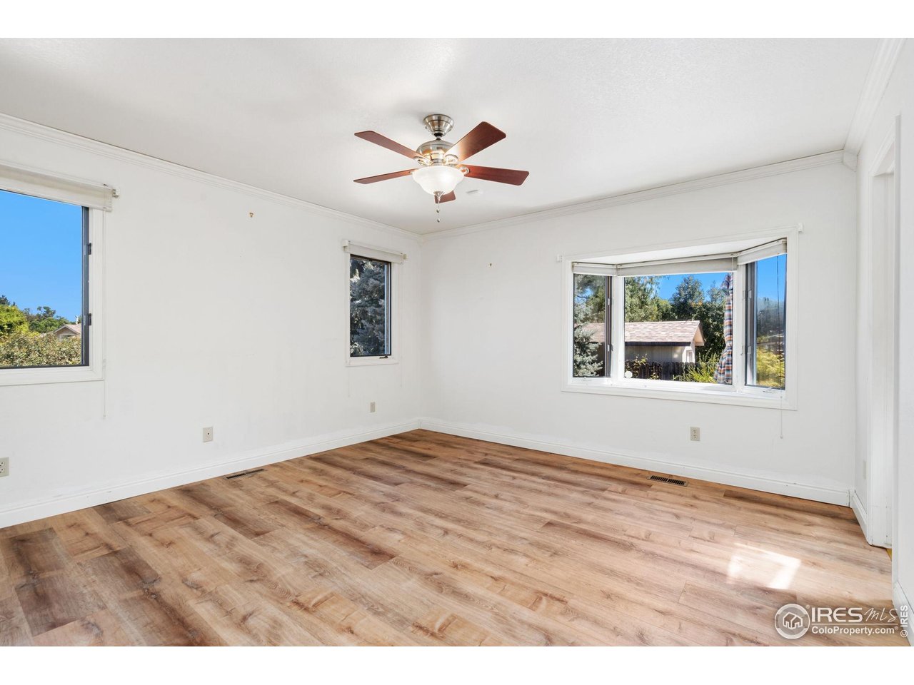 4331 West 16th Street Road Greeley, CO 80634 - Photo 22 of 41 Primary Bedroom With Bay Window Overlooking the Backyard