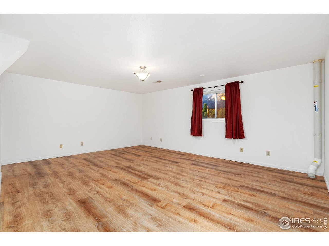 4331 West 16th Street Road Greeley, CO 80634 - Photo 25 of 41 Basement Recreation room with Luxury Vinyl Plank Flooring