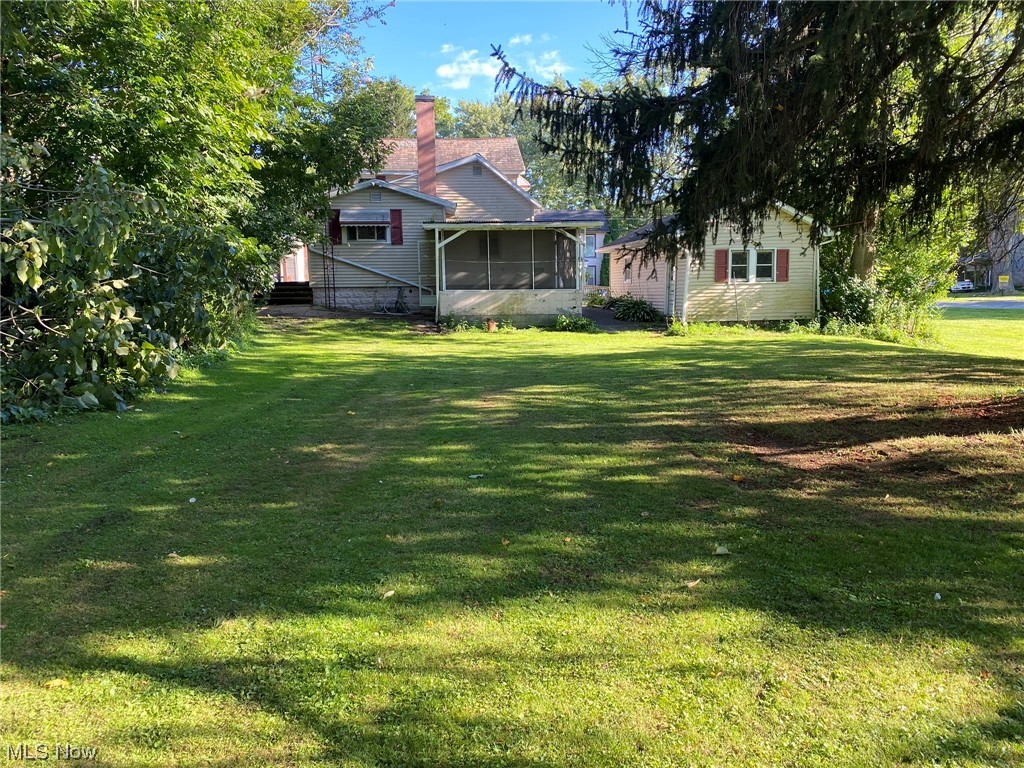 235 Ridge Street Leetonia, OH 44431 - Photo 12 of 15 Rear View of yard & enclosed screened patio.