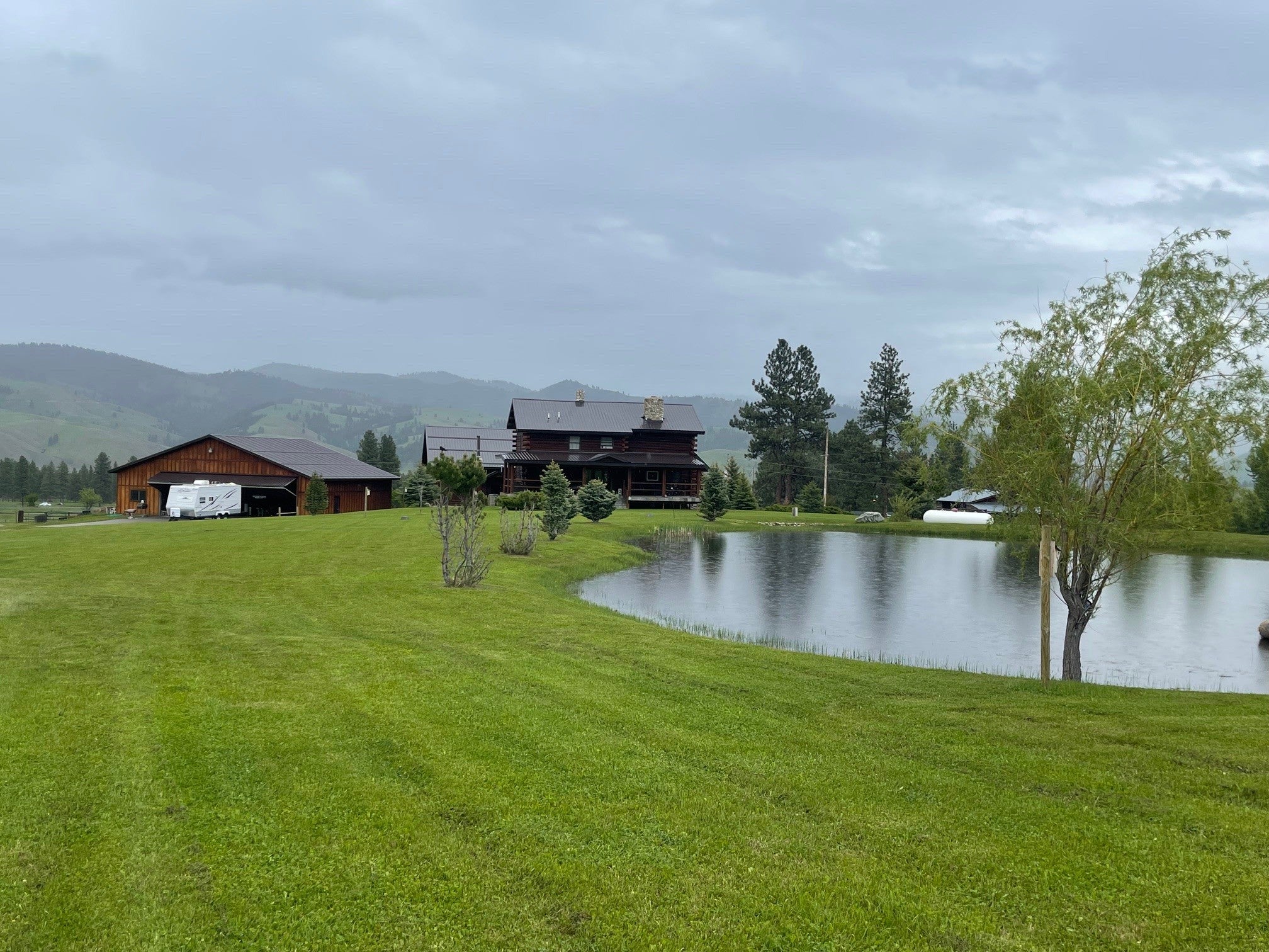 203 Hart Bench Road Darby, MT 59829 - Photo 36 of 56 The pond and backyard give any owner their own world. You can enjoy Montana living at its best!The pond and landscaped grounds create a world entirely your own ? a private sanctuary where Montana living is experienced at its finest.
