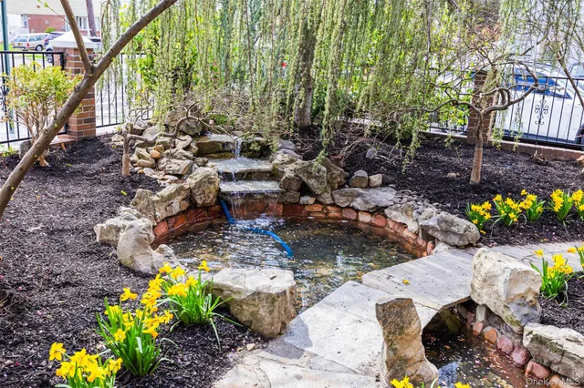a backyard of a house with a yard and outdoor seating