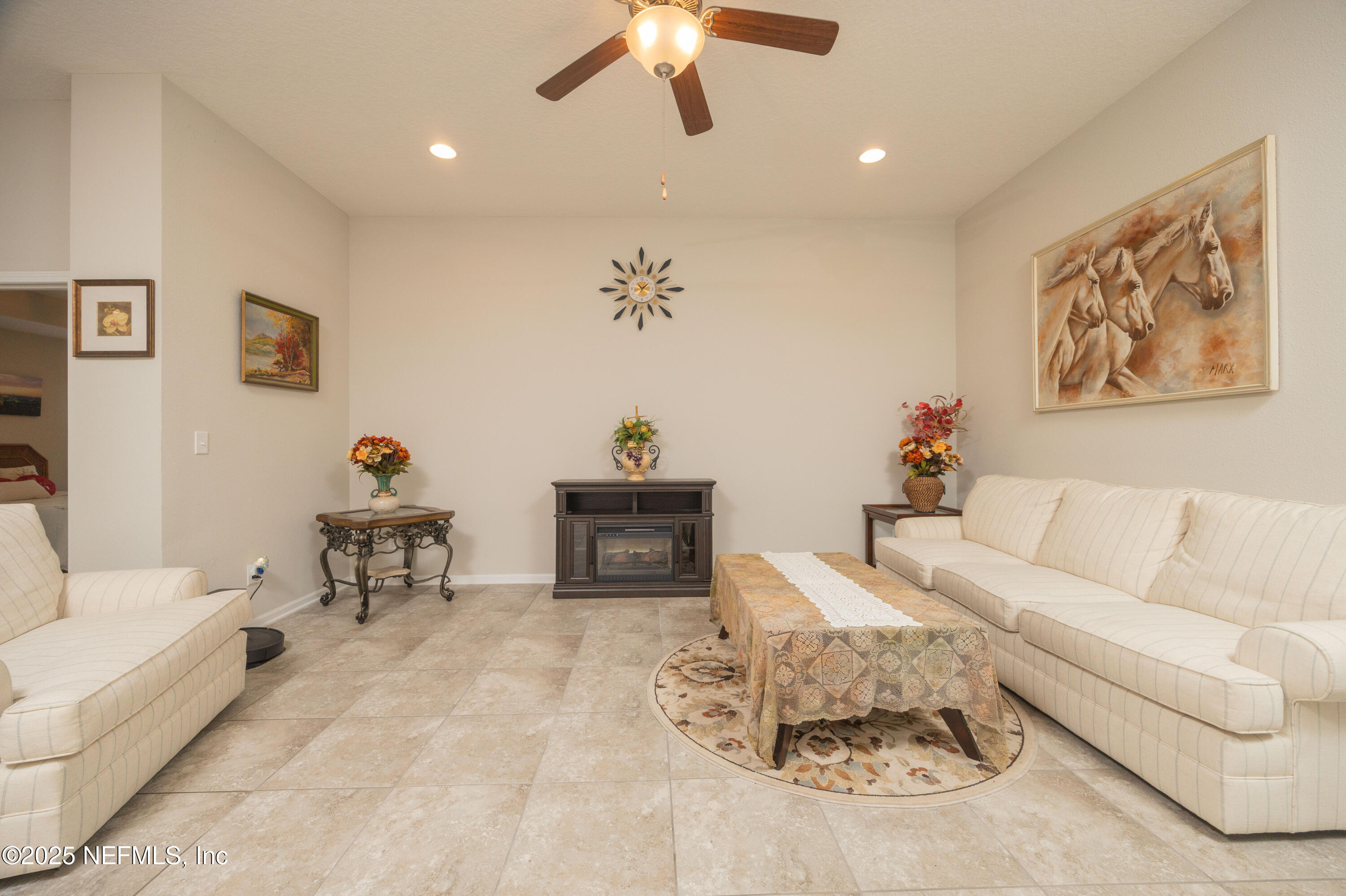 333 Old Hickory Forest Road St. Augustine, FL 32084 - Photo 11 of 62 a living room with furniture and a chandelier