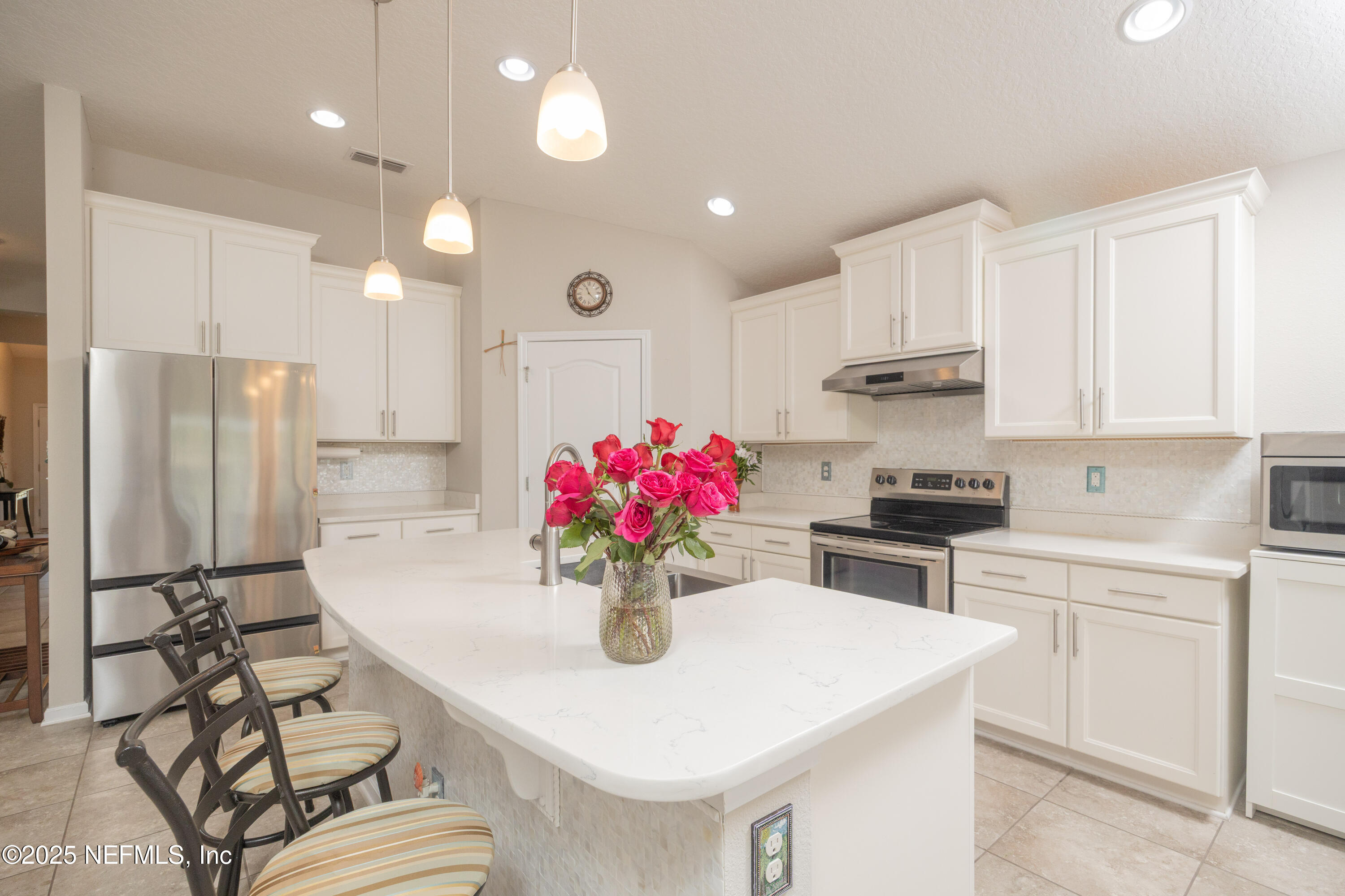 333 Old Hickory Forest Road St. Augustine, FL 32084 - Photo 15 of 62 a kitchen with stainless steel appliances kitchen island granite countertop a sink cabinets and refrigerator