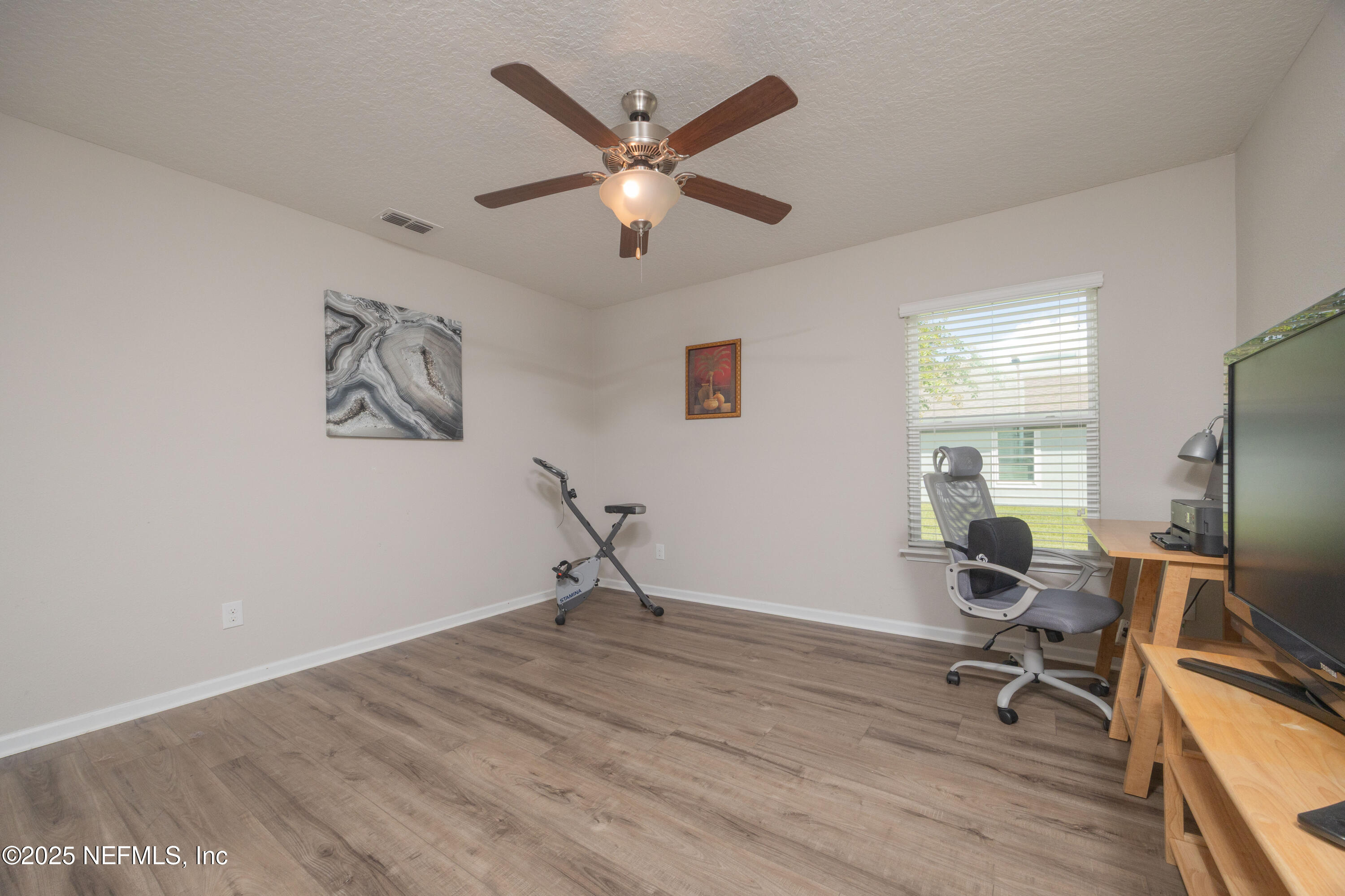 333 Old Hickory Forest Road St. Augustine, FL 32084 - Photo 27 of 62 a work room with wooden floor and a window