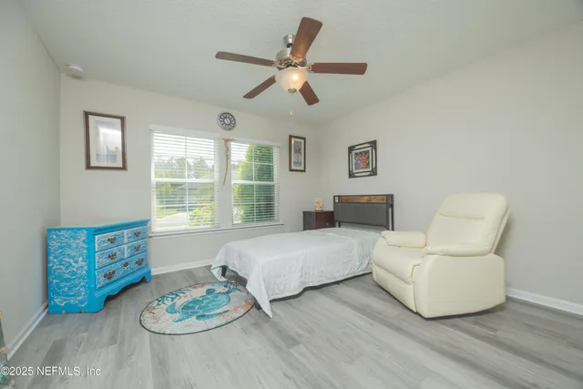 a bedroom with a bed and a dresser in it