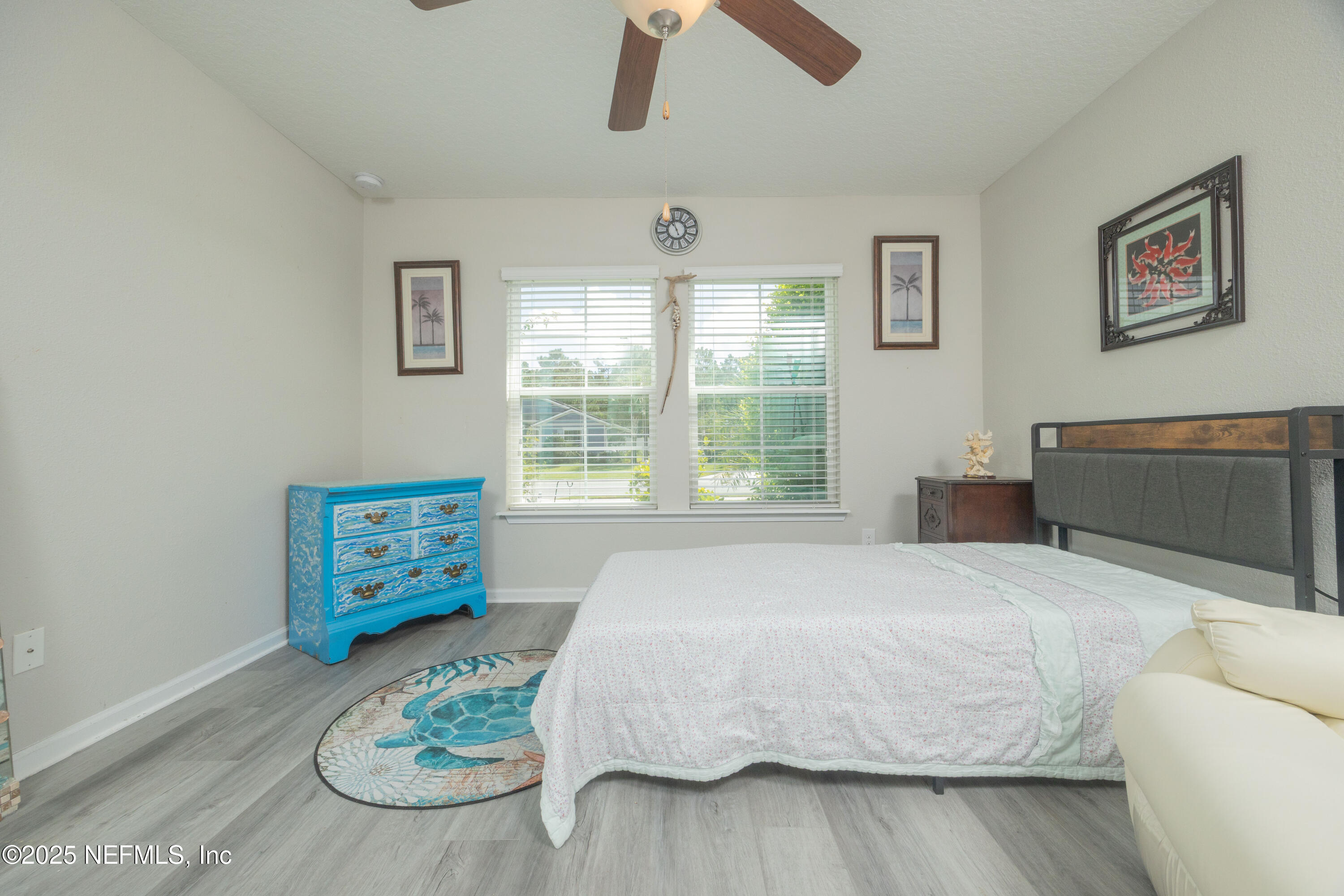 333 Old Hickory Forest Road St. Augustine, FL 32084 - Photo 30 of 62 a bedroom with a bed and wooden floor