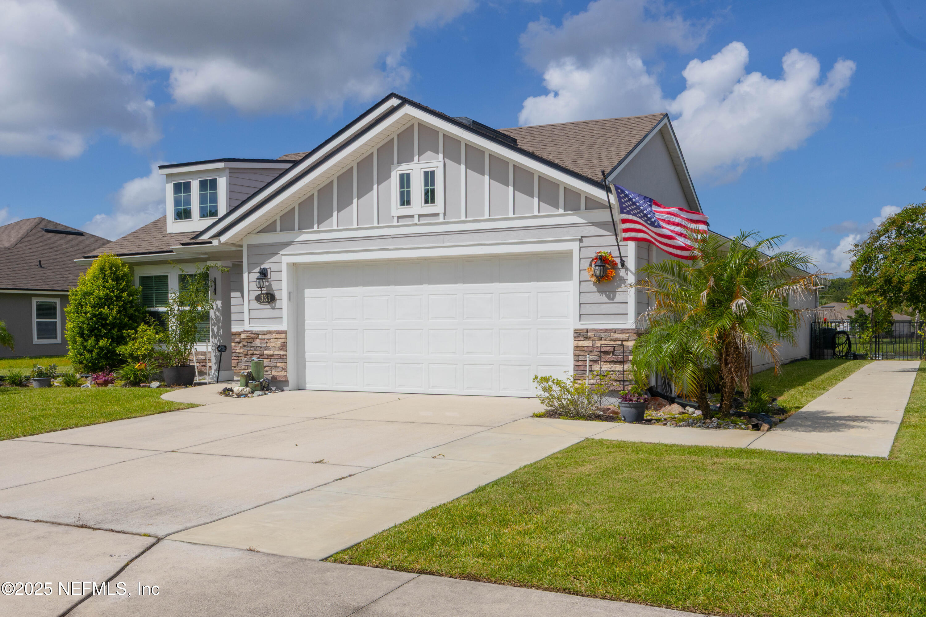 333 Old Hickory Forest Road St. Augustine, FL 32084 - Photo 3 of 62 a front view of a house with a yard