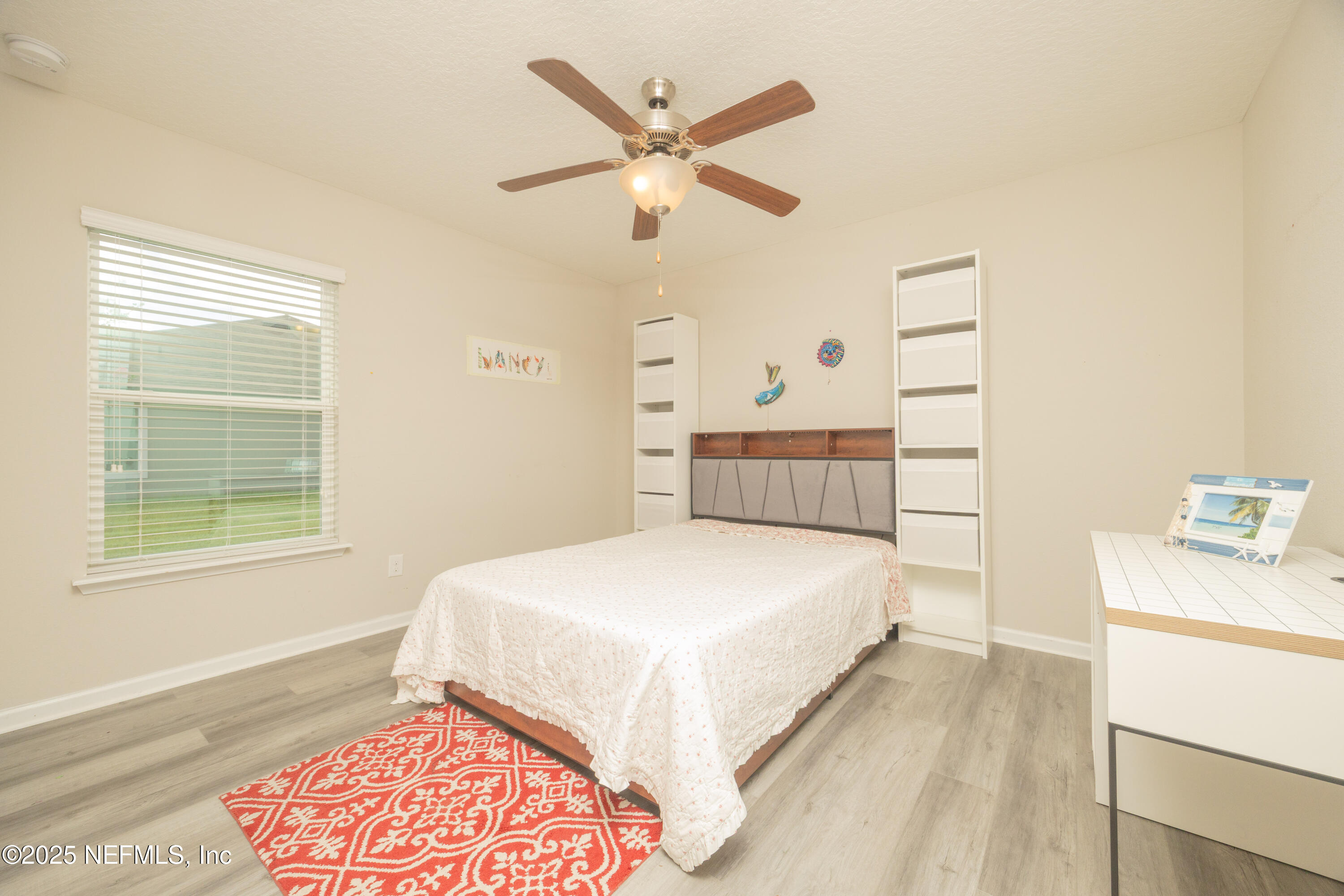 333 Old Hickory Forest Road St. Augustine, FL 32084 - Photo 32 of 62 a bedroom with a large bed and a chandelier